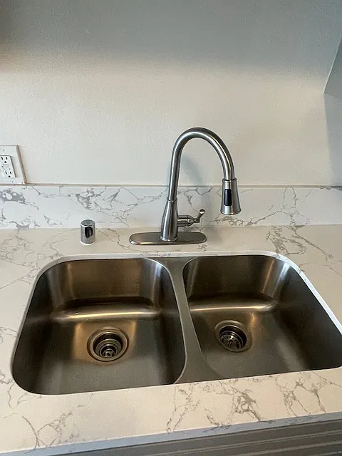 Sink has two sides and upgraded faucet