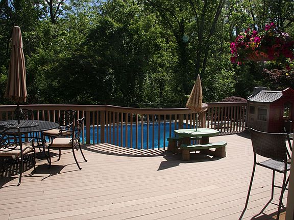 Oversized trex deck overlooking the pool.