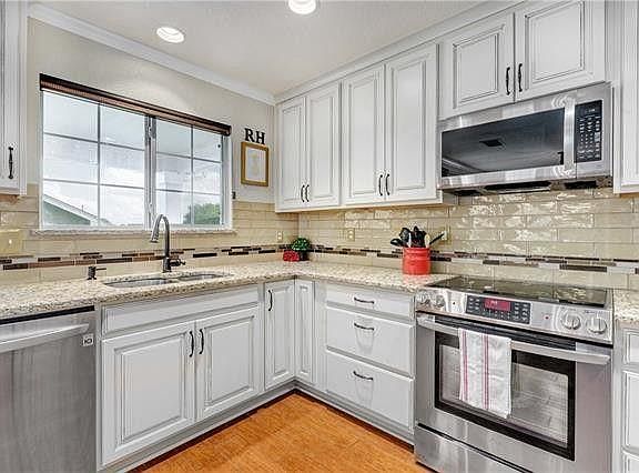 Kitchen overlooks back patio
