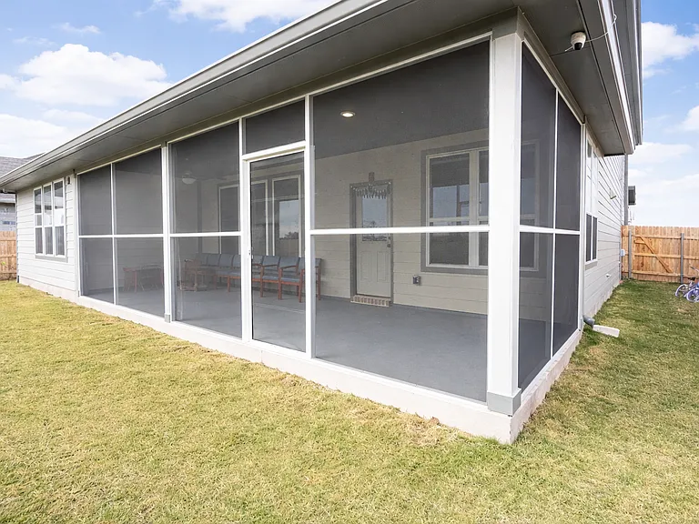 Covered & Screened back patio with painted floor