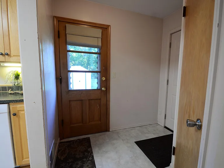 Kick Your Shoes Off in the Mud Room. Features Large Pantry. Provides access to kitchen, basement, garage, and backyard.