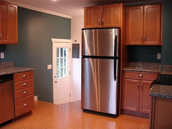 all new appliances, maple cabinets, slab granite counters