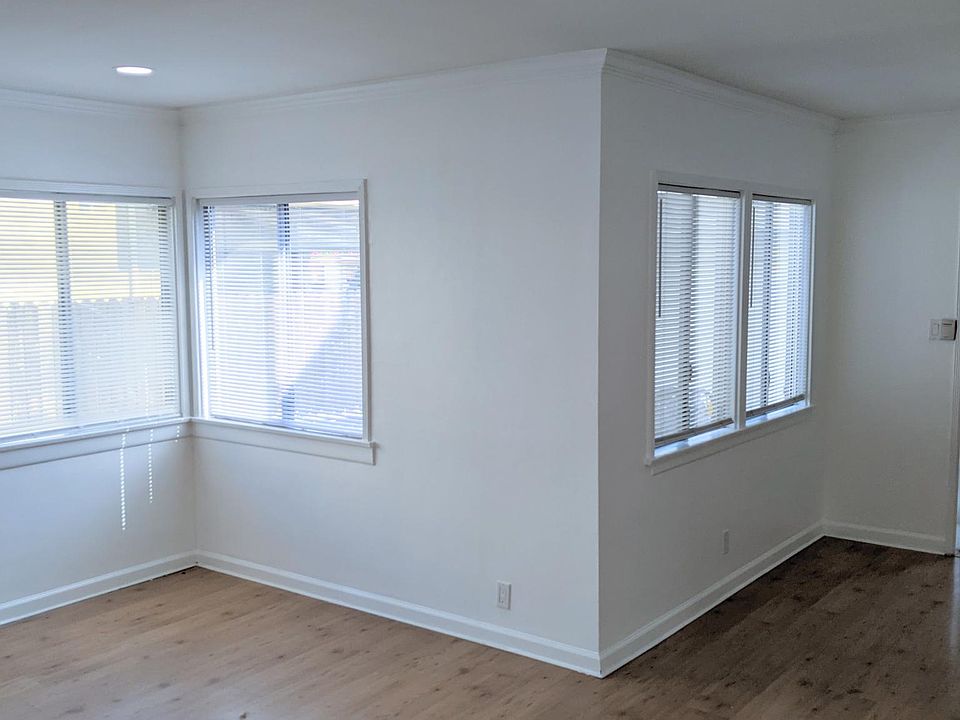 Bright living and dining room with recessed lighting