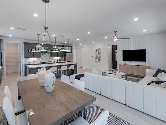 Connected kitchen, gathering room, and cafe