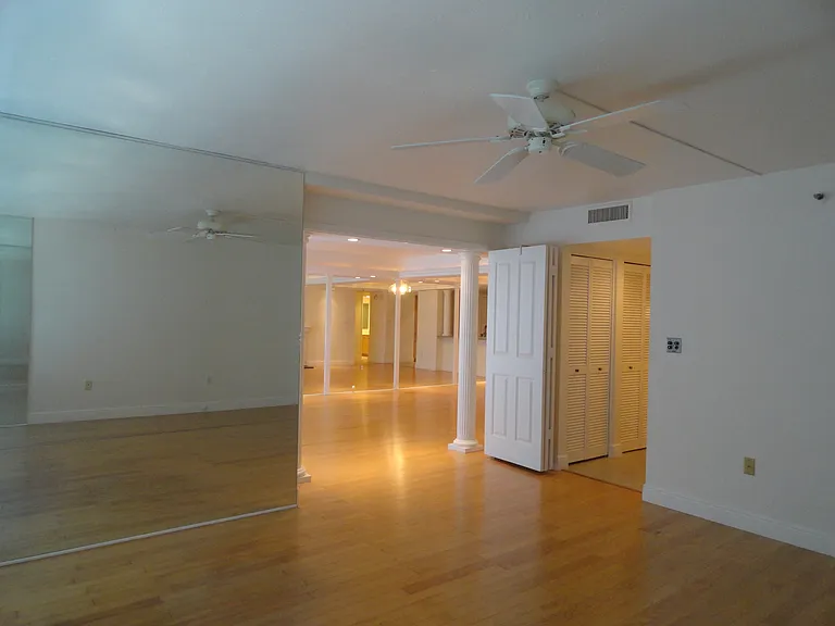From inside Bayfront Bedroom looking towards living room. Triple Bi-Fold doors to separate rooms.
