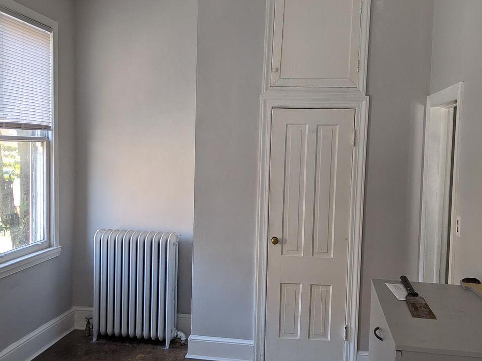 Front bedroom with 3 windows facing King Street. Behind the camera would be Henry Street