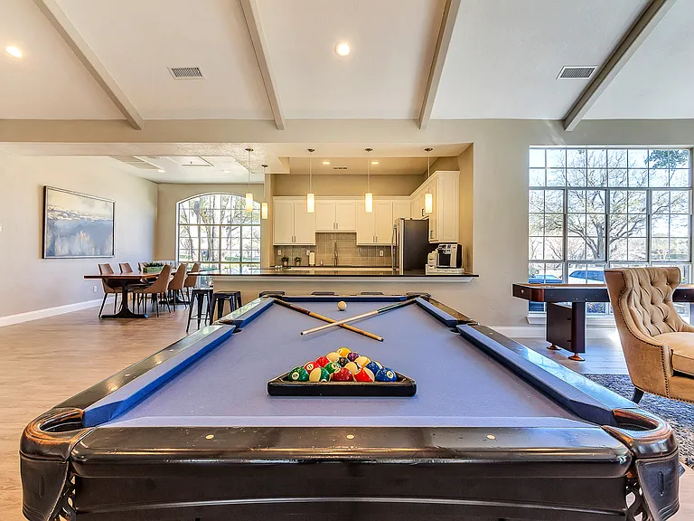 Resident lounge with on-site pool table and full entertainment kitchen for resident use