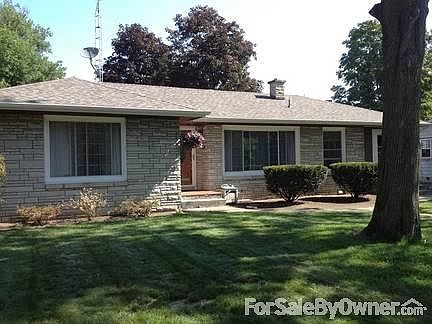 Back view of home/fenced in back yard