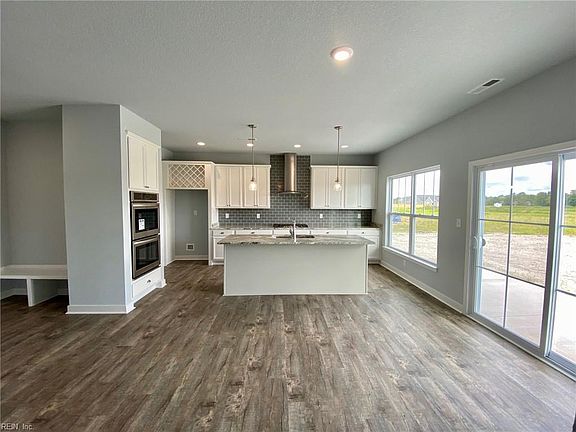Gourmet kitchen includes range hood