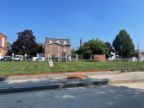 View directly across from this unit, land from elderly housing across the street.