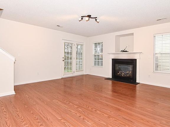 Living room with laminate floors and gas fireplace