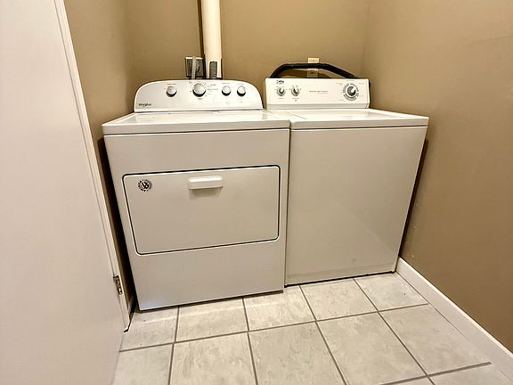 Laundry room with washer and dryer included.