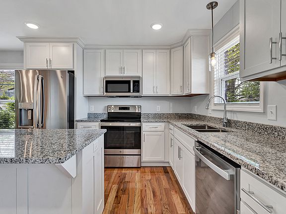 Kitchen w/ Refrigerator and Island