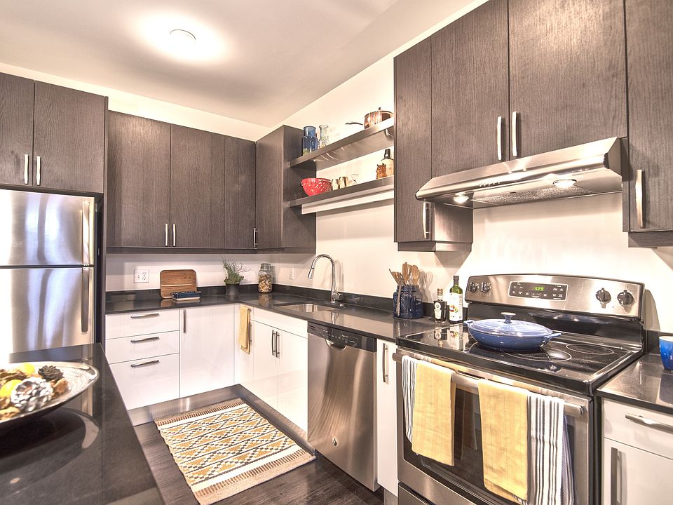 Sleek stainless steel appliances outfit these kitchens