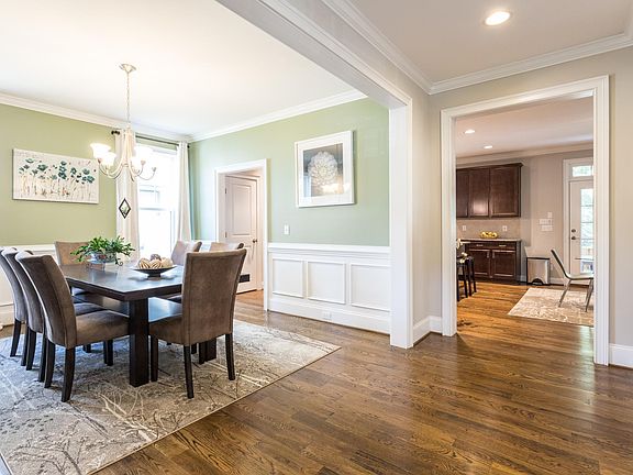 Wide entryway leads into dining room and kitchen