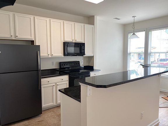 Bright, open, kitchen with breakfast nook and adjoining dining room