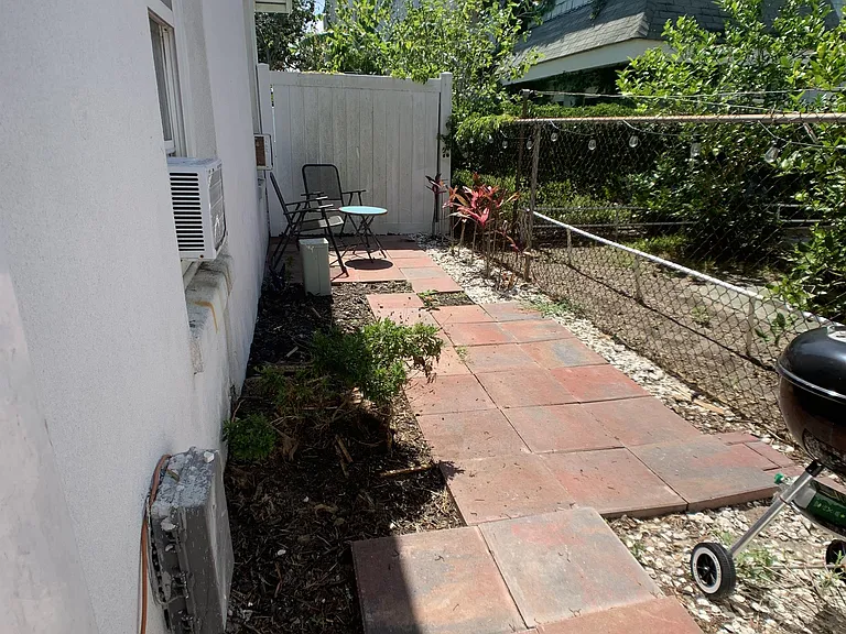 Private, gated and fenced side yard.