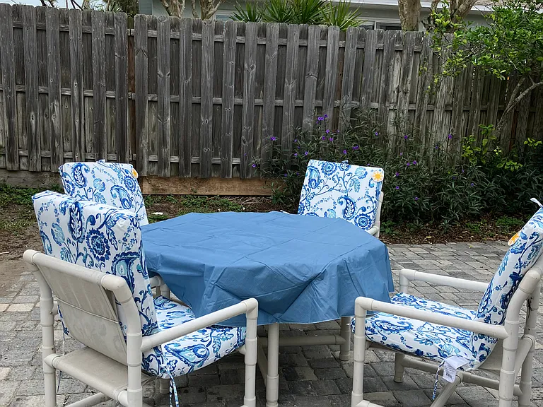 backyard close up - pavers, gate access from driveway. fully fenced in