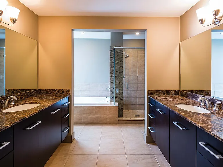 Master bathrooms feature both a deep soaking tub and walk-in shower