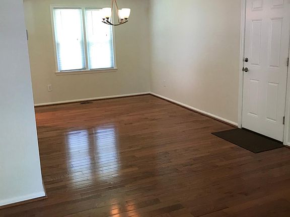 Living room and dining room.
Door to garage.