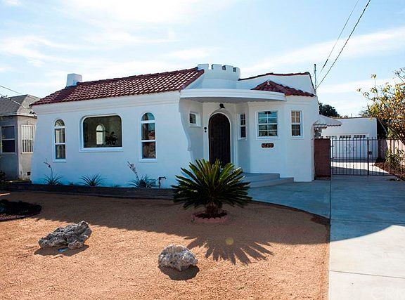 Spanish-style with charming curb appeal.