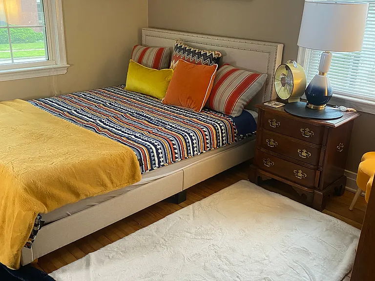 Front main floor bedroom with full bathroom in between the bedrooms.