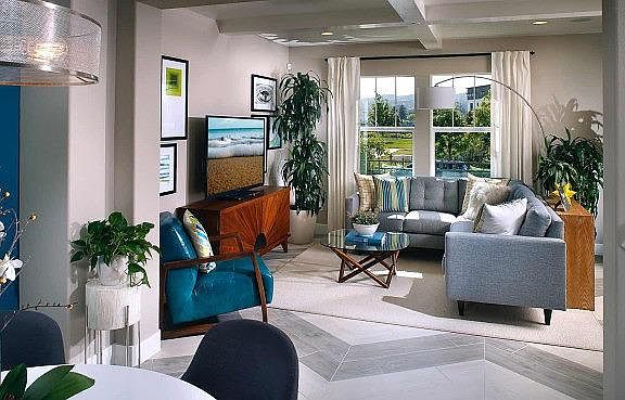Living room with open floor plan and park view