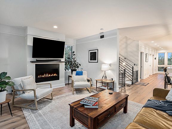 Large, sunny living area with fireplace