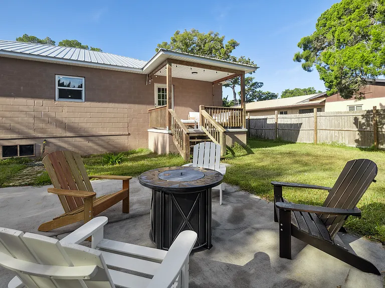 Fire Pit with Four chairs in Backyard