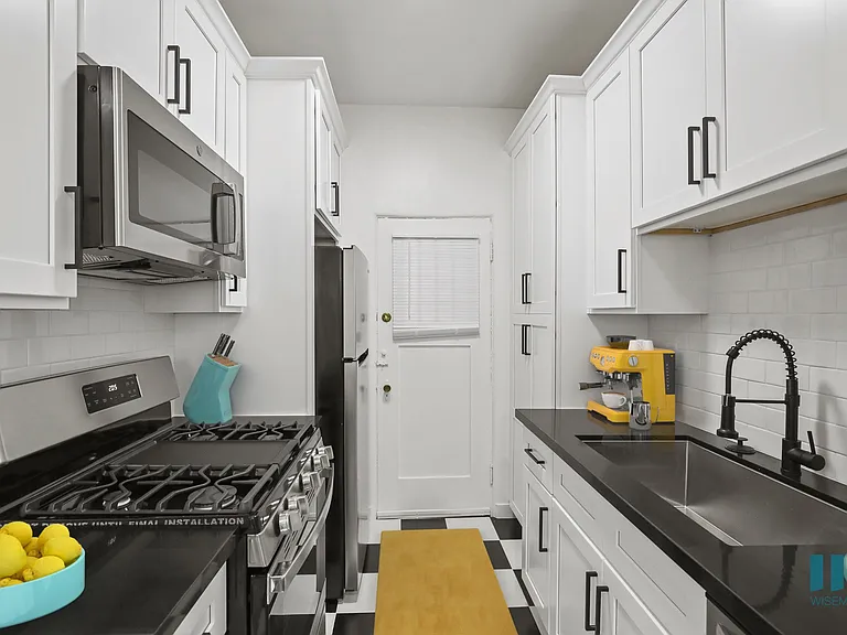 Kitchen with Stainless-Steel Refrigerator, Stove, Microwave Oven, and Dishwasher