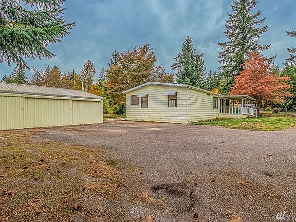 View of the house from the edge of the property. Lots of parking - the entrance is to right and across the way.