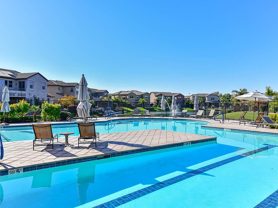 Lap and play pool, jacuzzi and water views plus lounging vignettes for relaxing pool time.