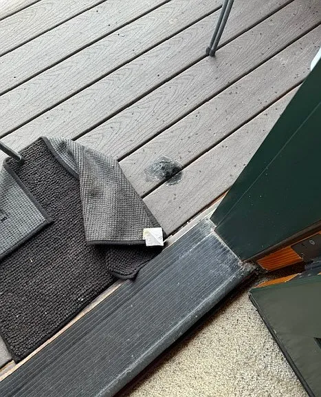 patio with burn hole from tenants Star and Quan