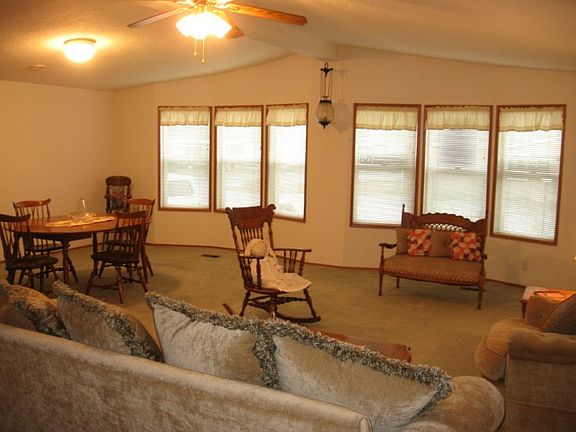 Living/dining room with vaulted ceilings taken from entry area.