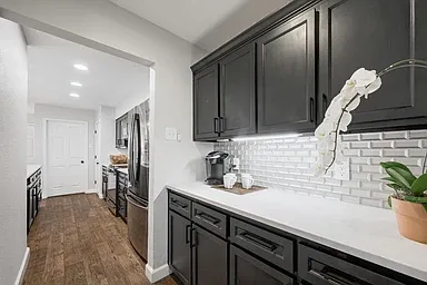 Butlers pantry for extra storage and coffee bar.
