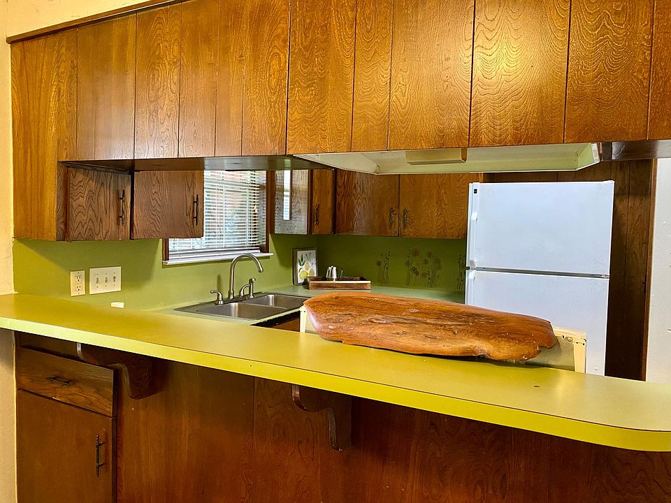 Kitchen has bar seating but open to dining area and living room.