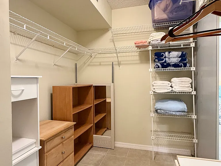 Other side of HUGE Primary walk-in closet.