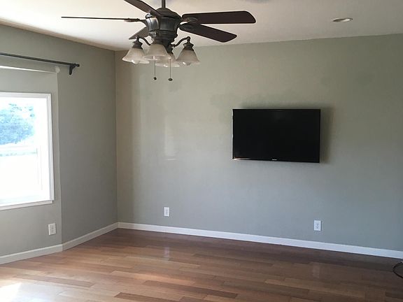 Living Room with fan, lots of light and space