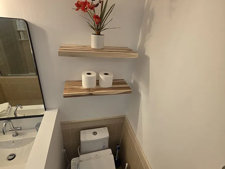 new smart toilet and dual vanity sinks. large bathroom