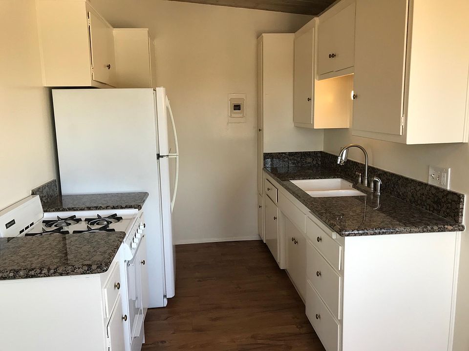 New fridge, granite countertops, and wood flooring