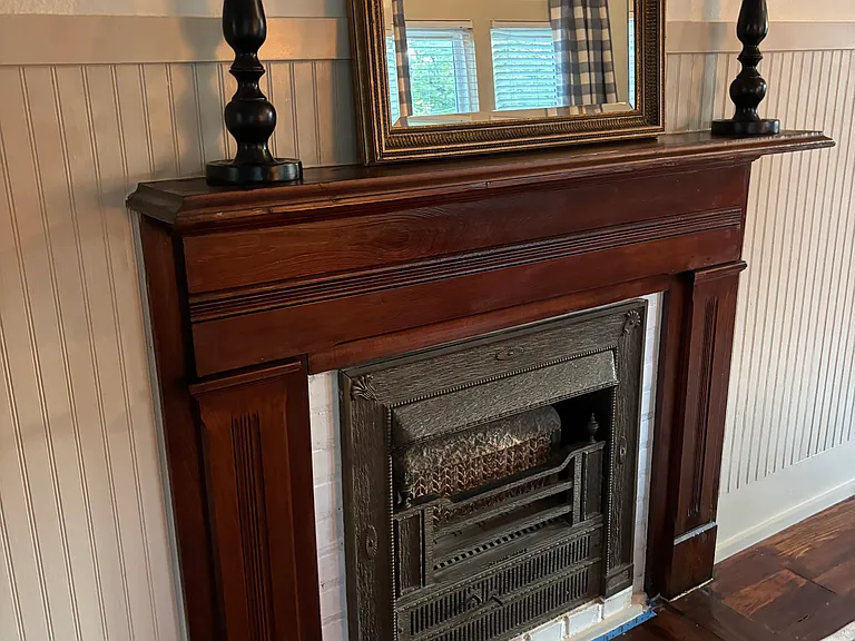 A unique fireplace mantle from a historic home in New Orleans _ beautiful pieces like this adorn spaces throughout the home
