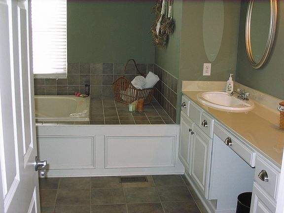 Spa-like master bath with beautiful tile surround on whirlpool tub . . aaah!