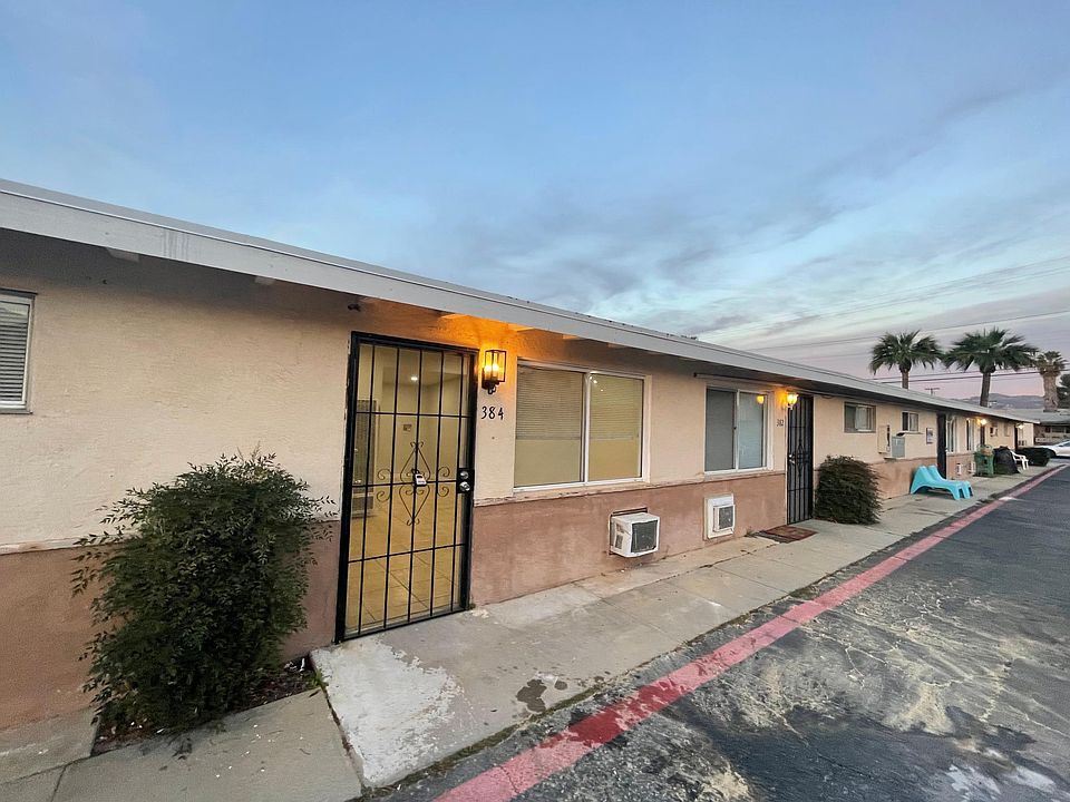 Single story with parking in front of unit.