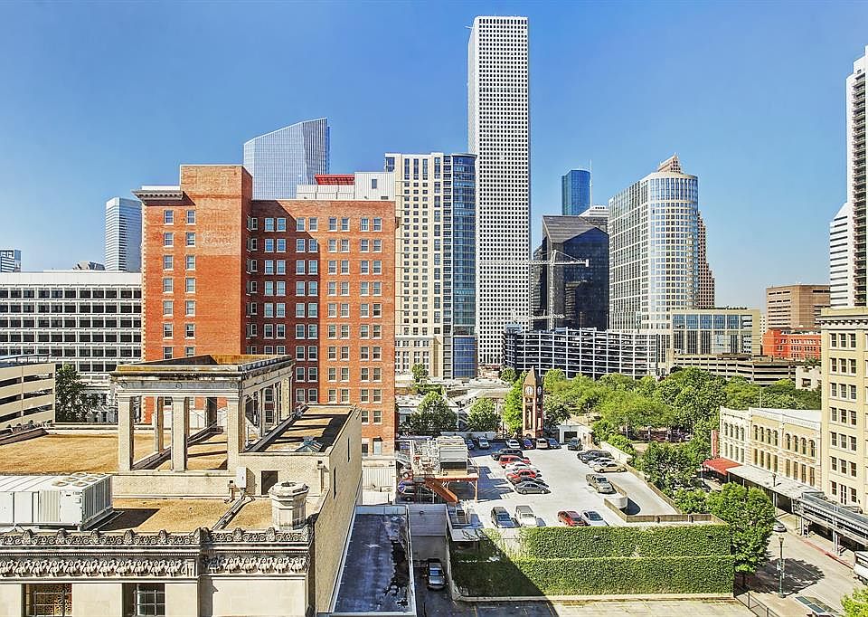 What a view from this 2 bedroom/2 bath unit at Historic Bayou Lofts in downtown Houston! Market Square Park with all the green t