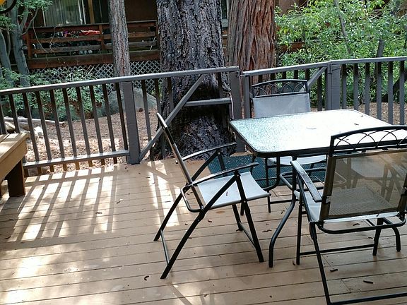 Your walk-out patio on the ground floor where you can eat or enjoy a coffee right next to the creek (just 5 steps off the deck).