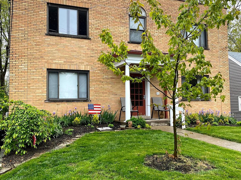 Beautiful, brick building with lush landscaping