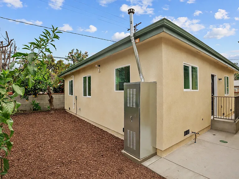 Side yard. Please note: image has been digitally altered.