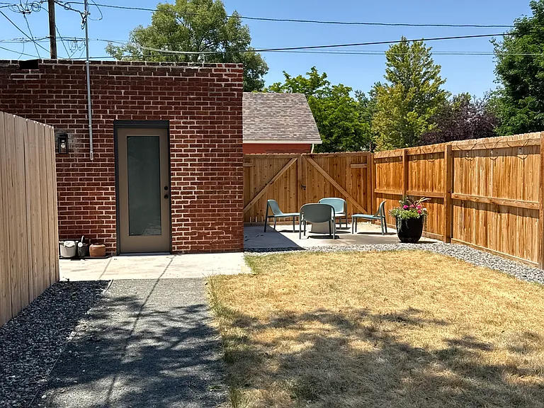 Backyard with patio area + single car garage