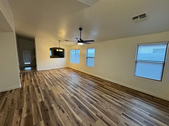 Spacious living room with brand new flooring and plenty of natural light