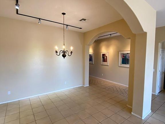 Large, entertainer's dining room area with overhead spotlight wall features. Picture taken November 13, 2023.